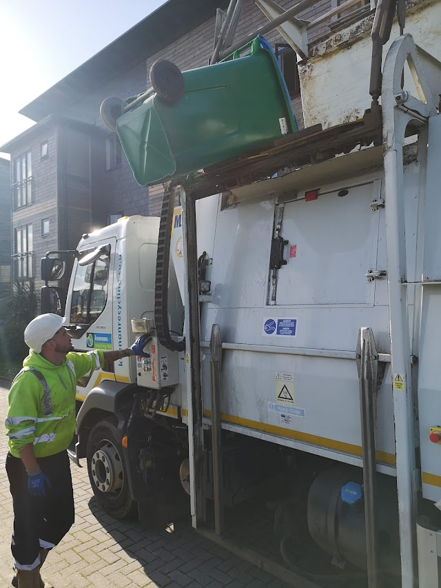 Bins being emptied into waste disposal truck