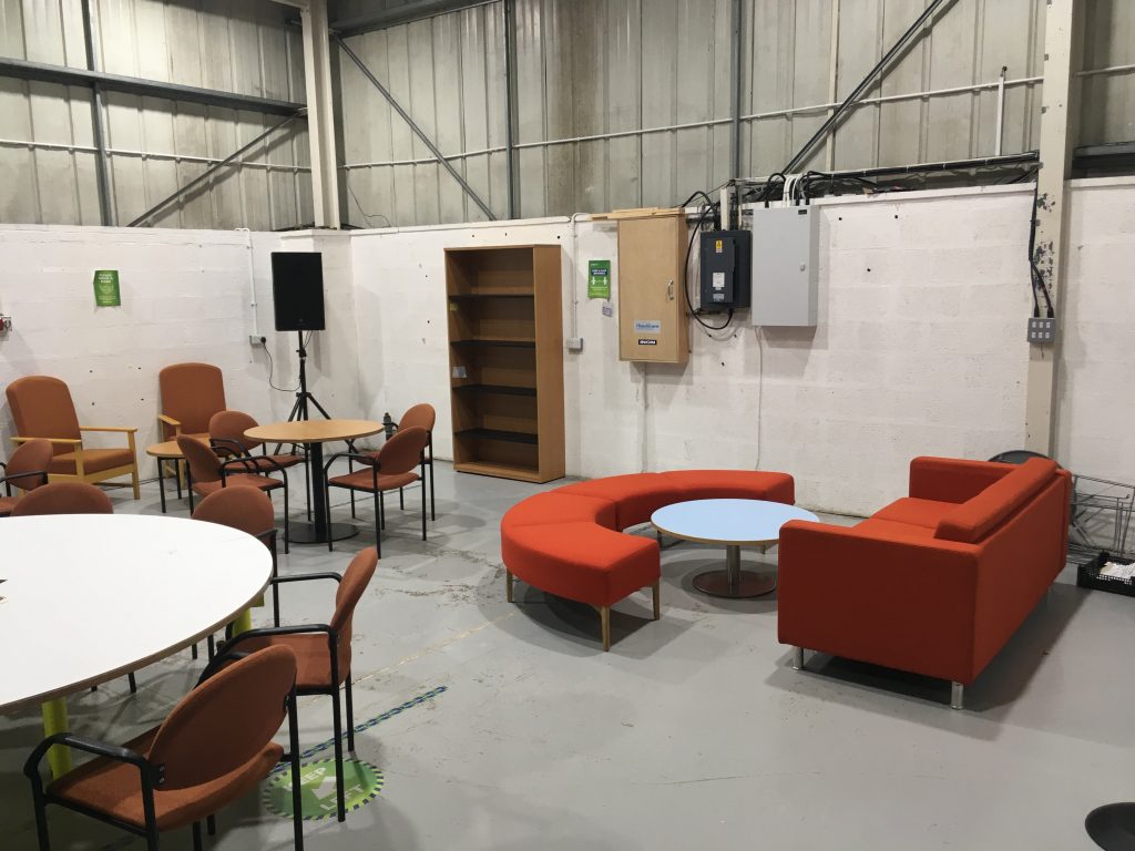 Red seating and some tables donated to Cornwall Business School