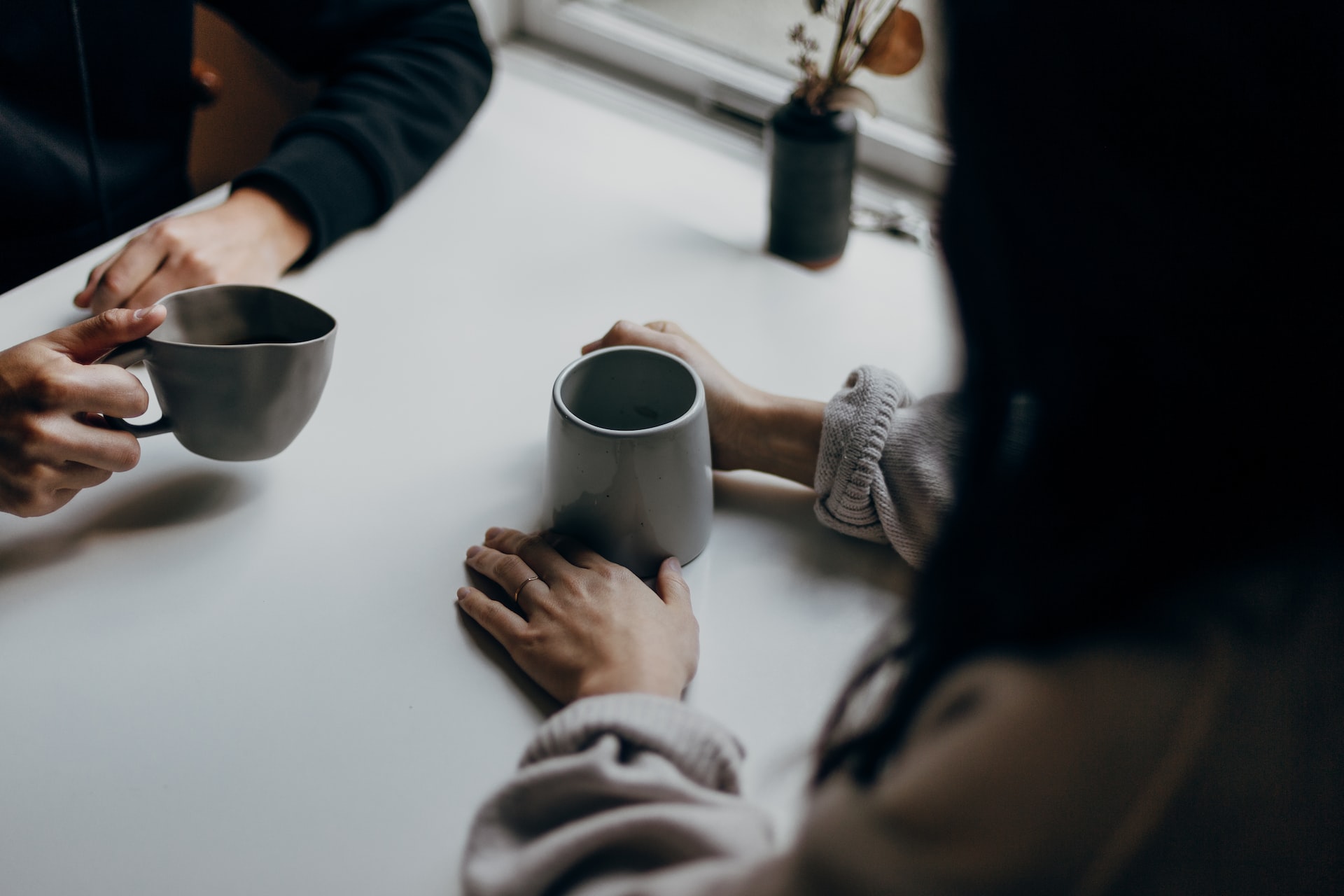 Two people having coffee together