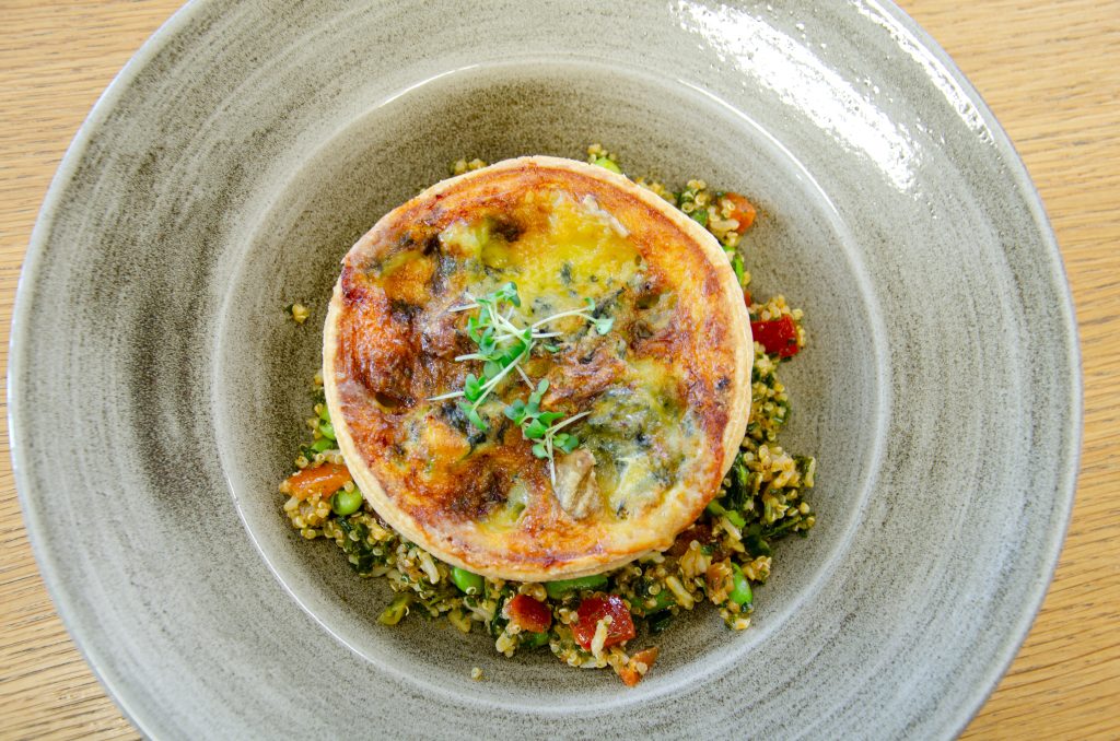 Image of a quiche on couscous, one of the mains plus salad options at the ESI Cafe.